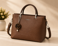 Brown Rose Charm Leather Handbag - Model View