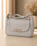 Ivory bow shoulder bag lifestyle shot