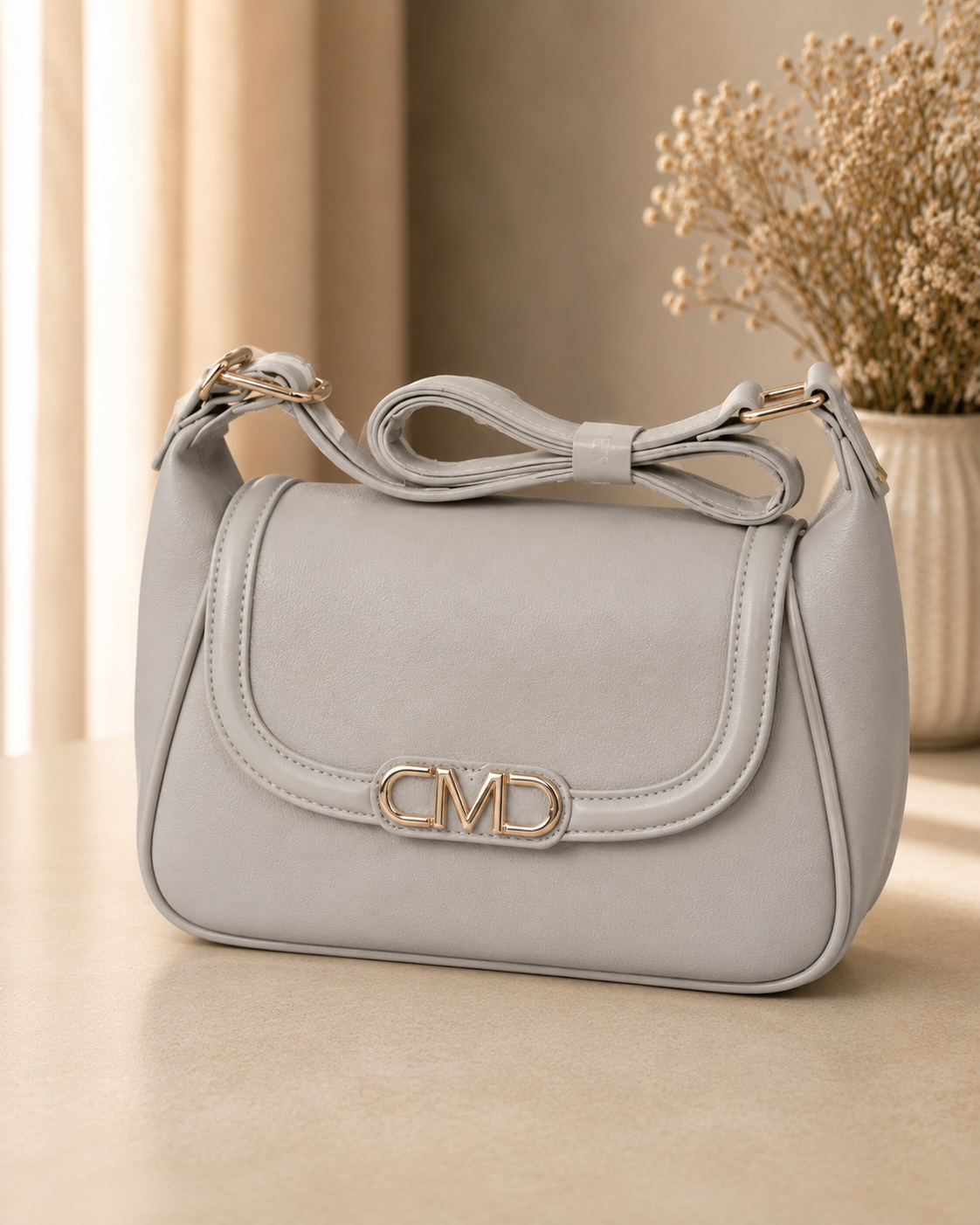 Ivory bow shoulder bag lifestyle shot