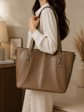 Mocha leather mega tote bag worn on shoulder