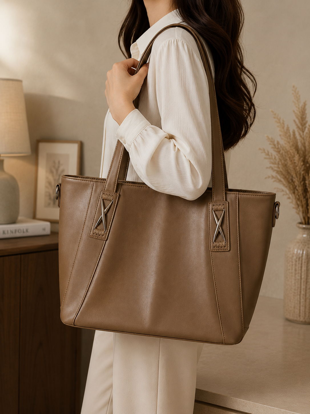 Mocha leather mega tote bag worn on shoulder
